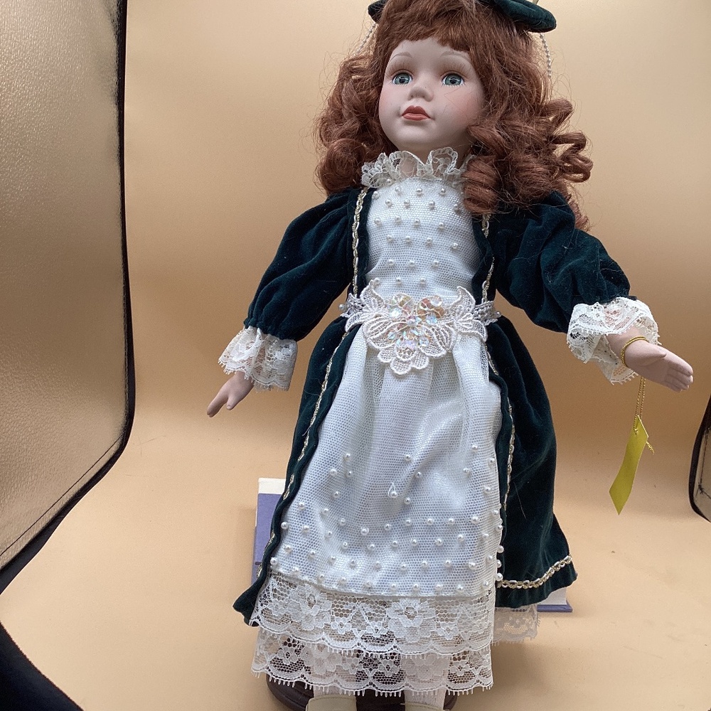 Porcelain doll  white and green dress “Candy”